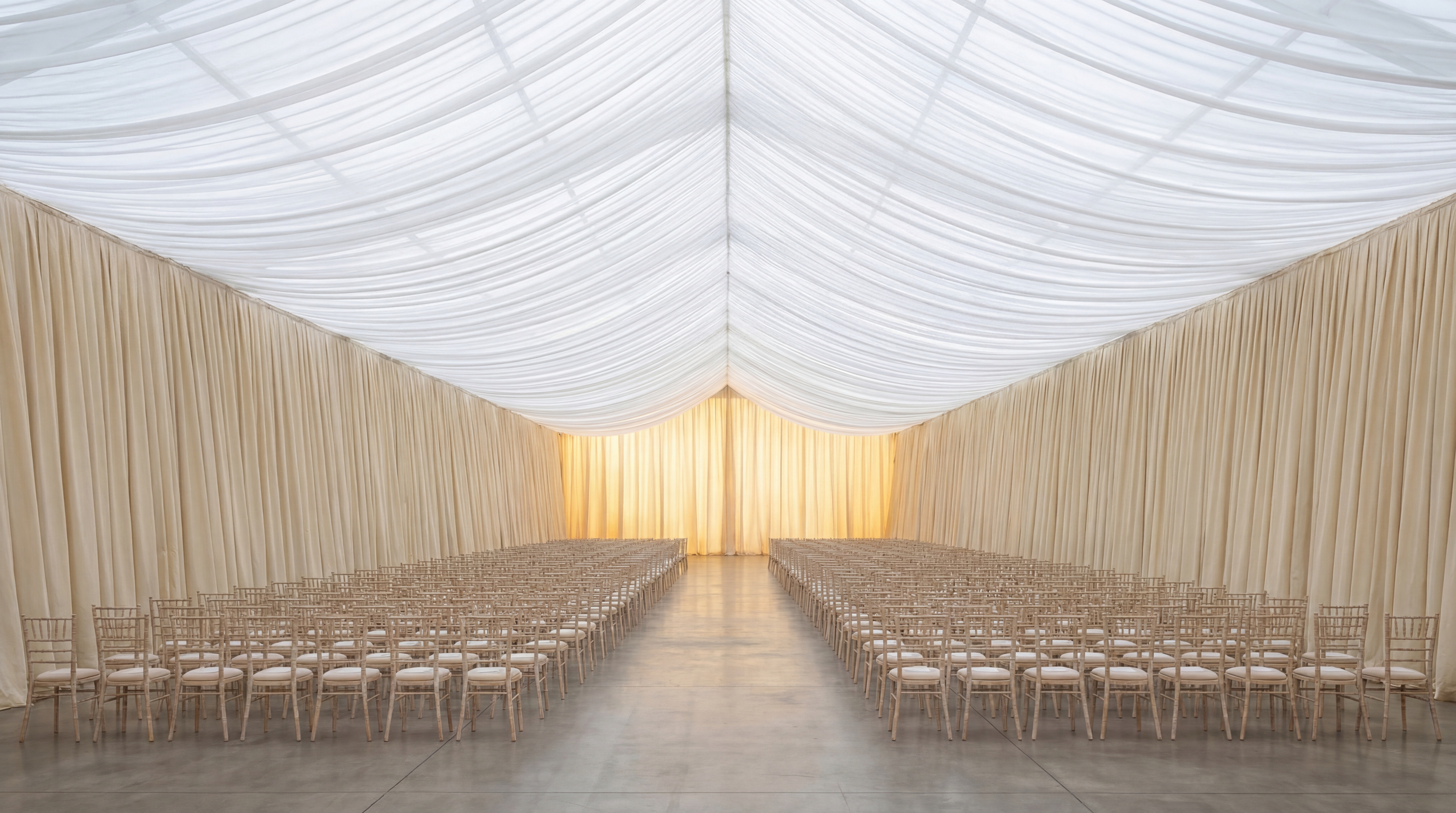Fully draped runway tent interior with translucent ceiling and pleated walls