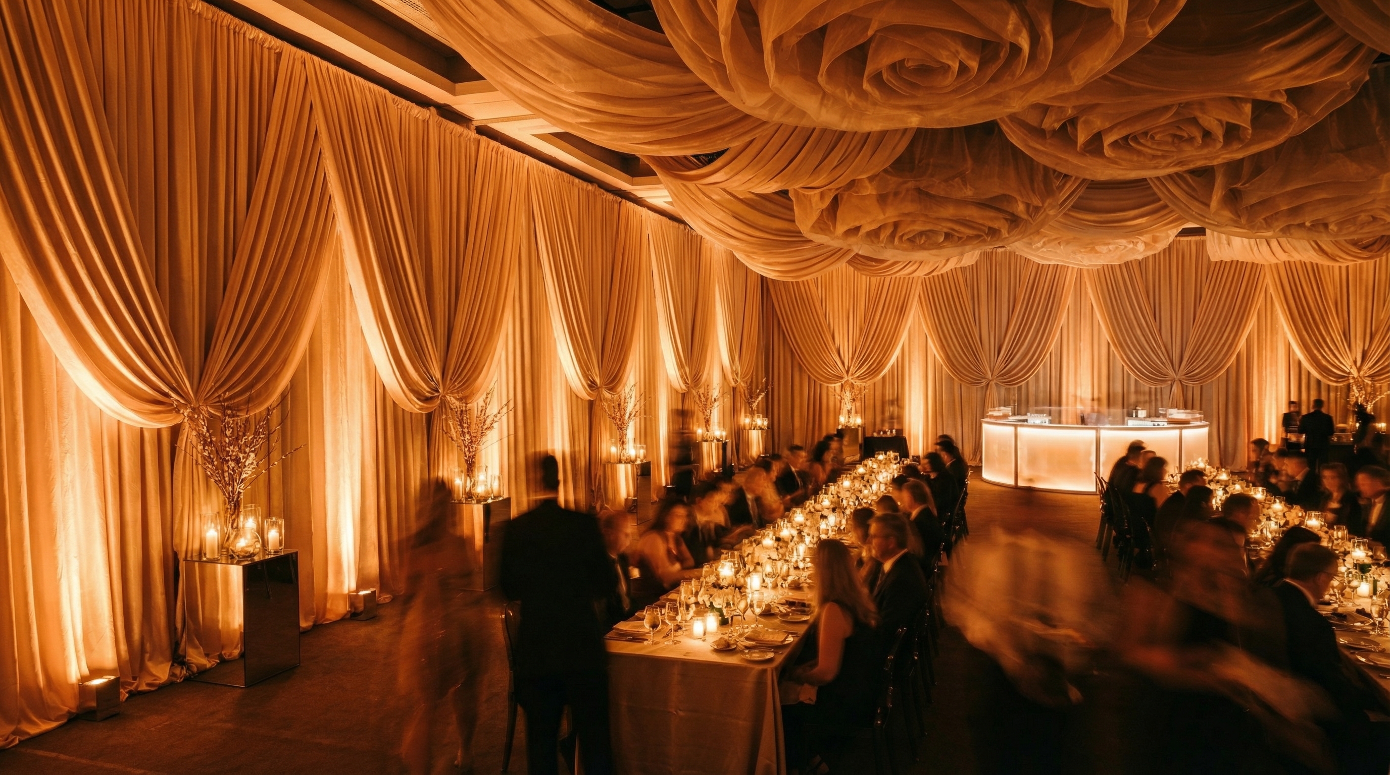 Gathered perimeter drapery treatment lining a ballroom wall