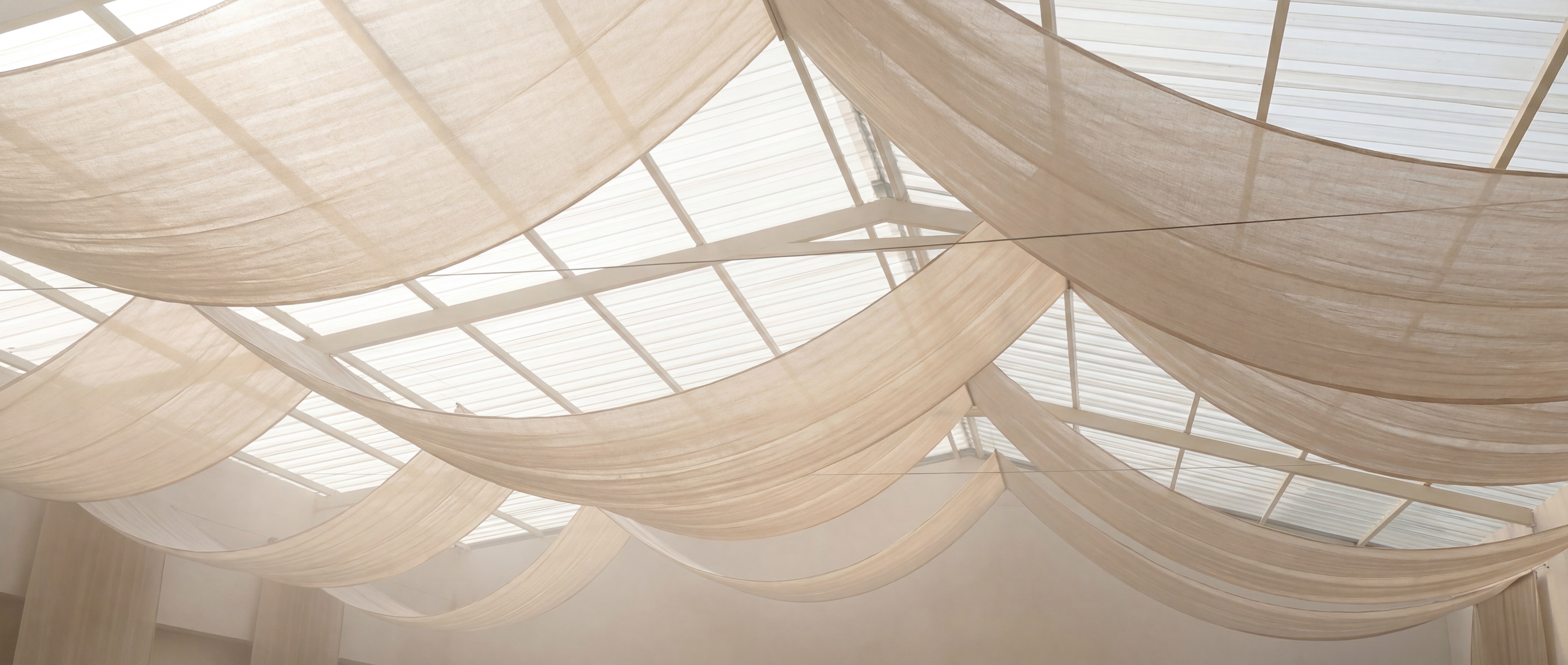 Drapery Society hero — sweeping drapery installation